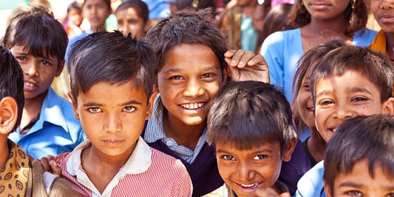 Sabbalpura, India - March 15, 2014: Group of happy indian school children posing in the rural village, Rajasthan, India.
